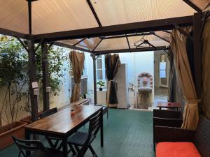 a dining room with a wooden table and chairs at My Friends in Florence
