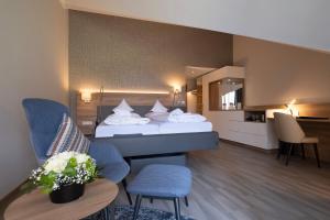 Postel nebo postele na pokoji v ubytování Hotel St. Wolfgang