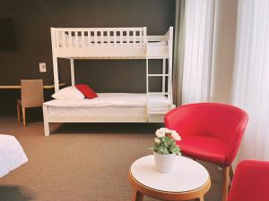 Postel nebo postele na pokoji v ubytování SwissTech Hotel