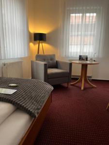 Ein Sitzbereich in der Unterkunft Hotel Anker