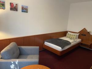 Ein Bett oder Betten in einem Zimmer der Unterkunft Hotel Anker