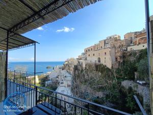 a view of a city from a balcony at Regina Margherita in Positano