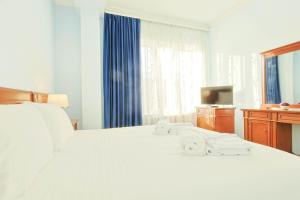 Lalaner Hotel房間的床