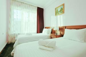 Lalaner Hotel房間的床