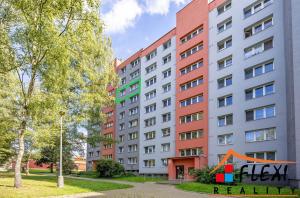 a large apartment building with graffiti on it at Krásný prostorný byt in Karviná