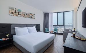 Voodi või voodid majutusasutuse Brown Jerusalem Hotel & Convention Center toas