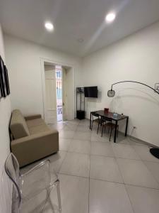 a living room with a couch and a table at Casa Vacanze Nemesi AURA in Salerno