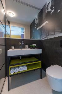 a bathroom with a sink and a toilet at New Suite On Hotspot Location With Fast Wifi in Tilburg +26 photos