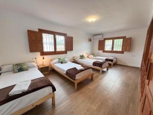 A bed or beds in a room at Villa Lucía - Benalmádena Costa
