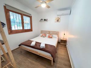 A bed or beds in a room at Villa Lucía - Benalmádena Costa