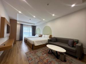 Giường trong phòng chung tại TMS Quy Nhơn Luxury Homestay