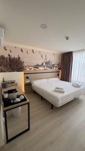 Postel nebo postele na pokoji v ubytování Hotel ELE Acueducto