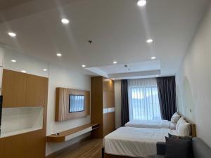 Giường trong phòng chung tại TMS Quy Nhơn Luxury Homestay