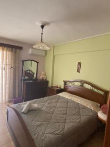 a bedroom with a large bed and a mirror at Central location! Spacious 2 bdrm with balcony in Sparta
