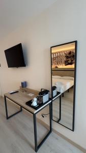 TV a/nebo společenská místnost v ubytování Hotel ELE Acueducto + 37 fotografií