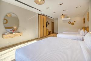A bed or beds in a room at Beyond Pyramids View