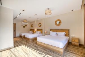 A bed or beds in a room at Beyond Pyramids View