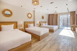 A bed or beds in a room at Beyond Pyramids View