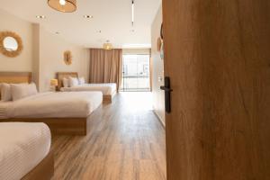 A bed or beds in a room at Beyond Pyramids View