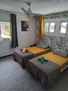 Postel nebo postele na pokoji v ubytování Ti Piment + 37 fotografií