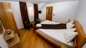 Postel nebo postele na pokoji v ubytování Transylvania Hills
