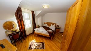 Postel nebo postele na pokoji v ubytování Transylvania Hills