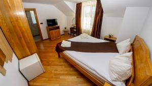Postel nebo postele na pokoji v ubytování Transylvania Hills