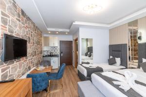 TV a/nebo společenská místnost v ubytování T-Square Residence