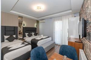 Postel nebo postele na pokoji v ubytování T-Square Residence