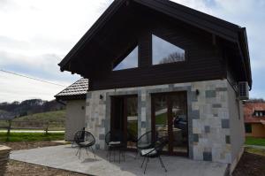 a group of chairs sitting outside of a building at Montana Goc in Goč
