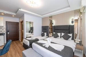 Postel nebo postele na pokoji v ubytování T-Square Residence