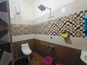 a bathroom with a toilet and a sink at Krishnalayam Heritage Villa in Elimala +43 photos
