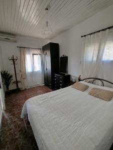 Postel nebo postele na pokoji v ubytování Villa Cottage Eleni