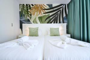 Ένα ή περισσότερα κρεβάτια σε δωμάτιο στο Palm Suites +36 φωτογραφίες
