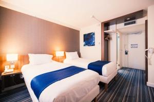 Postel nebo postele na pokoji v ubytování Holiday Inn Express Lille Centre by IHG