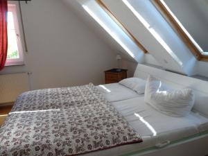 a white bed in a room with a window at Zinnowitz, Seestr 3b WE 22 in Zinnowitz