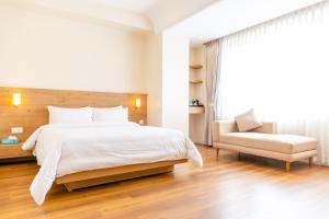 Tempat tidur dalam kamar di Hotel snowlion
