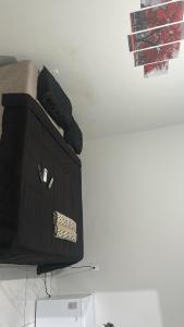 a black box with a tag on top of it at Pousada Aconchego Diamantina in Mucuri +32 photos