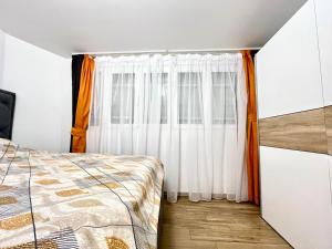 a bedroom with a bed and a window at 3 bedroom apartment Budva in Budva
