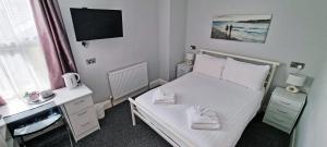 Postel nebo postele na pokoji v ubytování Medehamstede Hotel