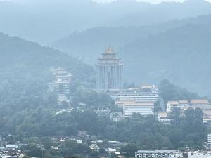 a city with a clock tower in the distance at SunshineResidence 5pax Near Georgetown in Ayer Itam