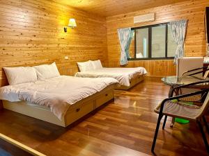 Letto o letti in una camera di He Ya Leisure Land B&B