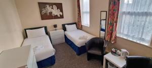 Postel nebo postele na pokoji v ubytování Medehamstede Hotel