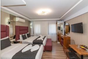TV a/nebo společenská místnost v ubytování T-Square Residence
