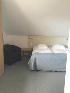 Postel nebo postele na pokoji v ubytování Adels Hotel