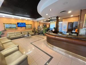 a lobby of a hospital with a waiting room at Hotel Valganna in Milan