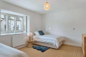 Finest Retreats - Tree View tesisinde bir odada yatak veya yataklar