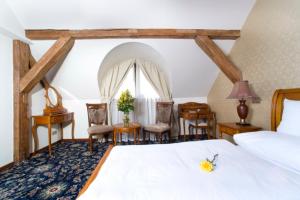 Postel nebo postele na pokoji v ubytování Chateau Zbiroh