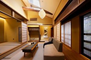 a living room with a couch and a table at Minn Nijo-jo in Kyoto
