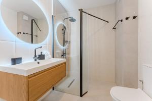 a bathroom with a sink and a shower at Atlantic View Premium Oceanfront Suite in Costa Del Silencio